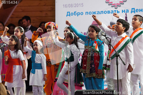 Image of Kids of Center of India folk art sing a song on a scene