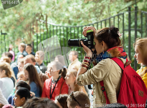 Image of Girl photographer with bag