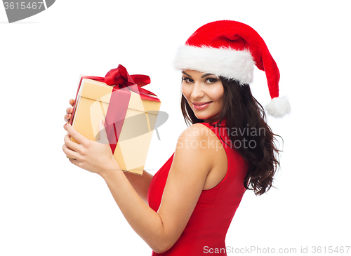 Image of beautiful sexy woman in santa hat with gift box