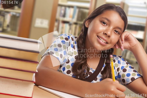 Image of Hispanic Girl Student Studying in Library