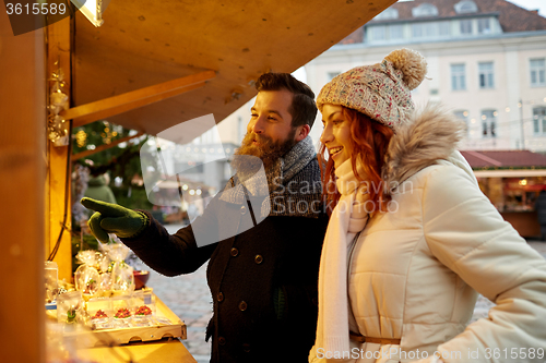 Image of happy couple walking outdoors