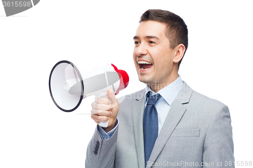 Image of happy businessman in suit speaking to megaphone