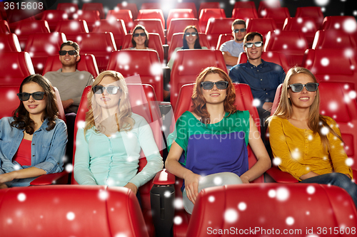 Image of happy friends watching movie in 3d theater