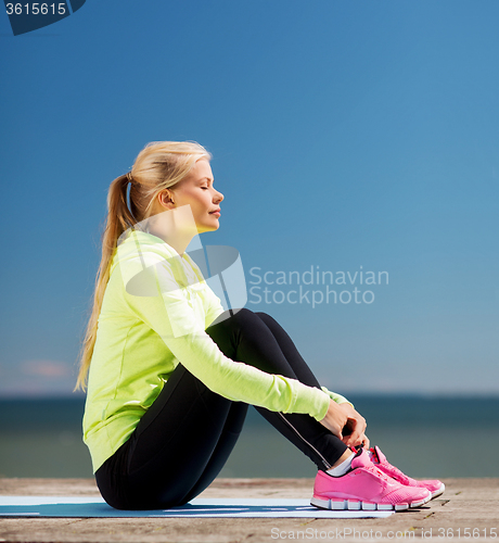 Image of woman doing sports outdoors