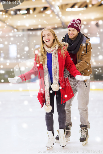 Image of happy couple on skating rink