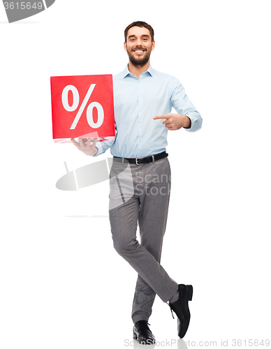 Image of smiling man with red shopping bag