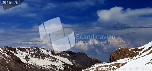 Image of Panoramic view on rocks with snow.