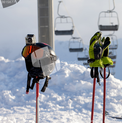 Image of Protective sports equipment on ski poles at ski resort