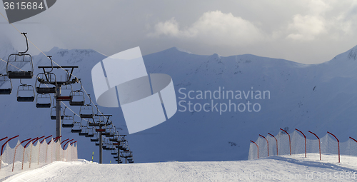 Image of Panoramic view on snow skiing piste and ropeway