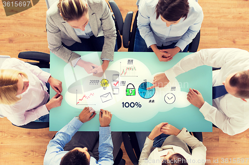 Image of close up of business team sitting at table