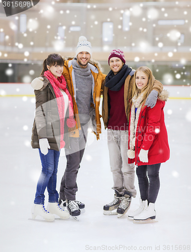 Image of happy friends on skating rink