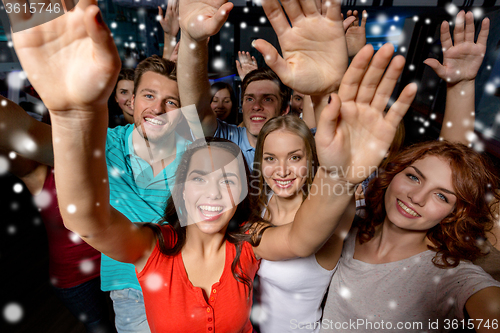 Image of smiling women dancing in club