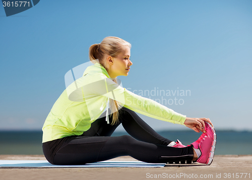 Image of woman doing sports outdoors