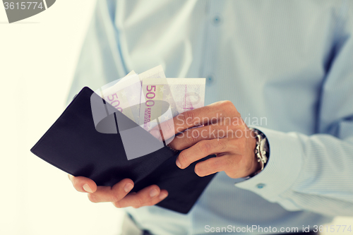 Image of close up of businessman hands holding money