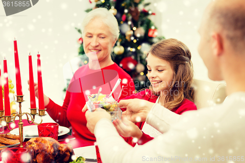 Image of smiling family having holiday dinner at home