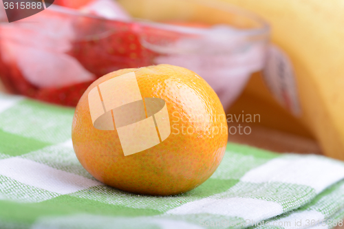 Image of many different fruits for the health of the entire family, peach, mandarin, strawberry slices