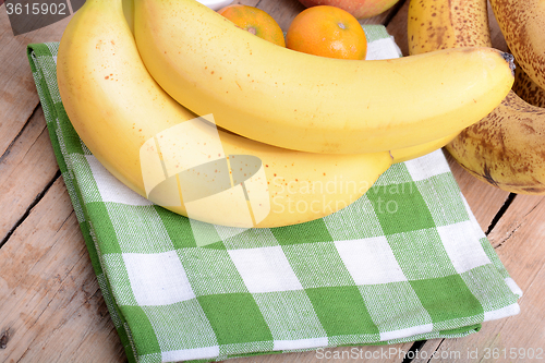 Image of mandarin, bananas and apples, health fresh food close up