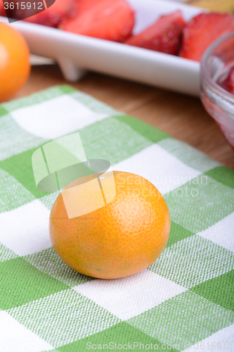 Image of mandarin and strawberry slices as health food concept