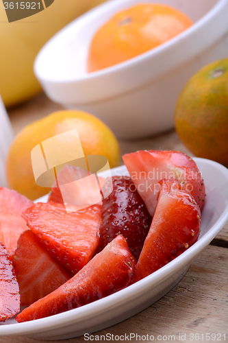 Image of Fresh colorful fruits composition mandarin, strawberry, peach, bananas and orange