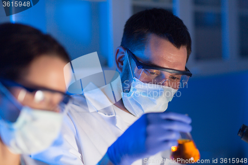 Image of close up of scientists making test in lab