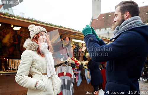 Image of couple taking selfie with smartphone in old town