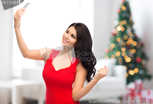 Image of sexy woman taking selfie picture by smartphone