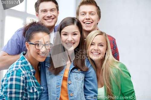 Image of group of happy high school students or classmates