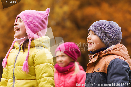 Image of group of happy children in autumn park