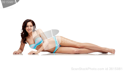 Image of happy young woman lying in bikini swimsuit