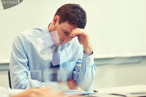 Image of businessman having problem in office