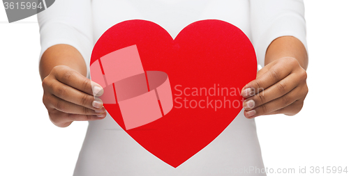 Image of closeup of woman hands with heart