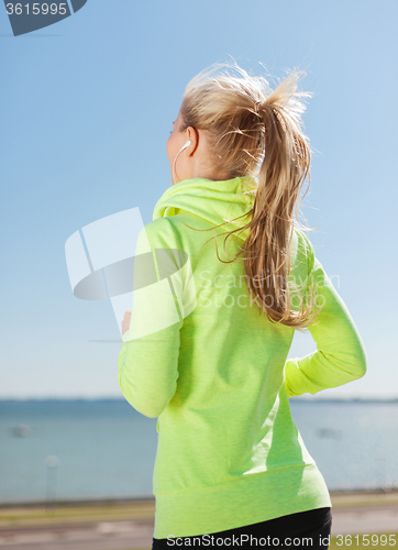 Image of woman doing running outdoors