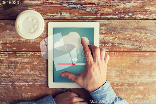 Image of close up of hands with tablet pc transferring data