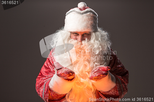 Image of happy Santa Claus looking at camera