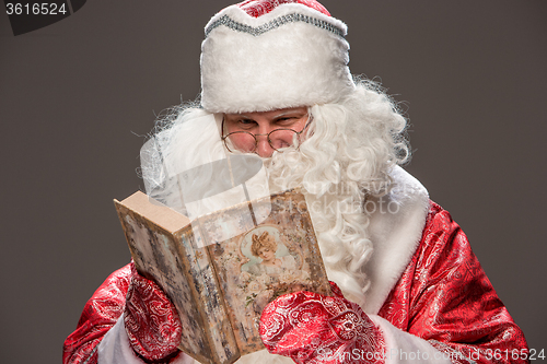 Image of Santa Claus reading book