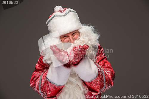 Image of happy Santa Claus looking at camera