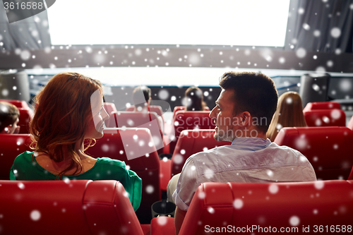 Image of happy friends or couple watching movie in theater