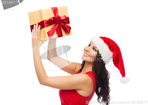 Image of beautiful sexy woman in santa hat with gift box