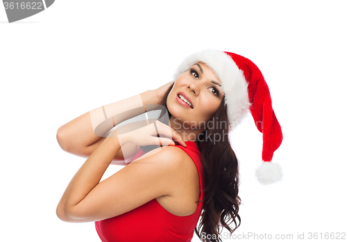 Image of beautiful sexy woman in santa hat and red dress