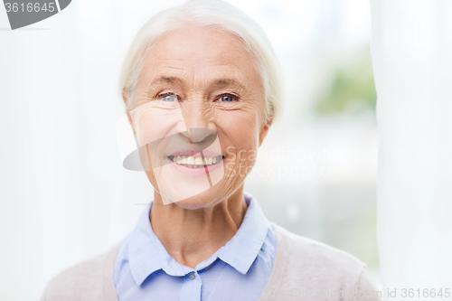 Image of happy senior woman face at home