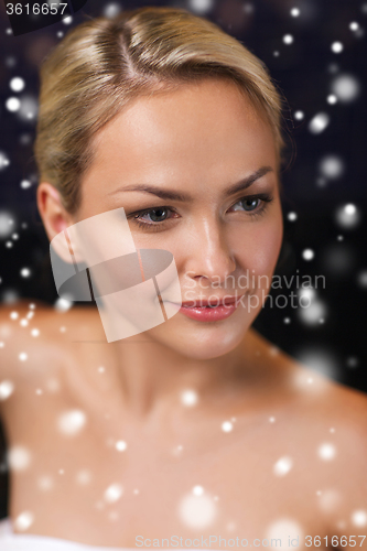 Image of close up of young woman in bath towel at sauna