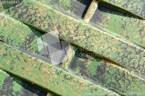 Image of Green metal texture with patches of rust steel on its surface, taken outdoor