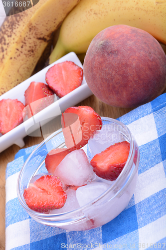Image of peach strawberry bananas mandarin close up as health food concept