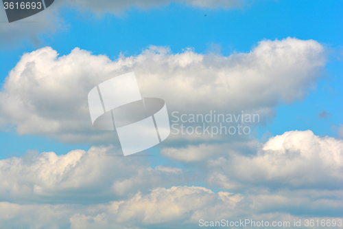 Image of white fluffy clouds in the blue sky