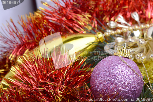 Image of Closeup of Christmas balls and green fir tree branch, new year invitation card