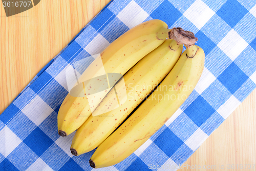 Image of Bunch of bananas on white bowl, health food concept