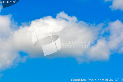 Image of white fluffy clouds in the blue sky