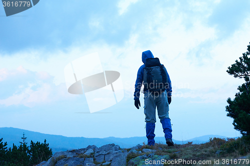 Image of advanture man with backpack hiking