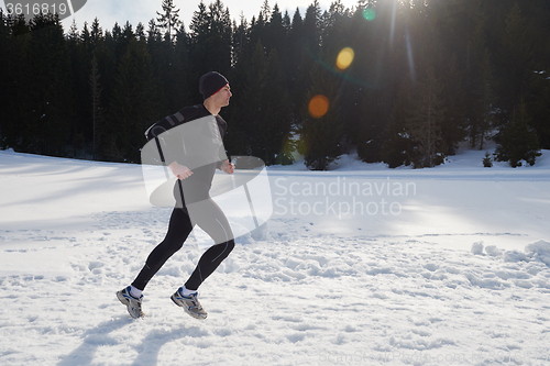 Image of jogging on snow in forest