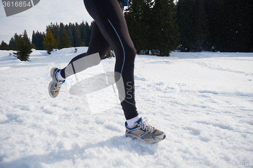 Image of jogging on snow in forest